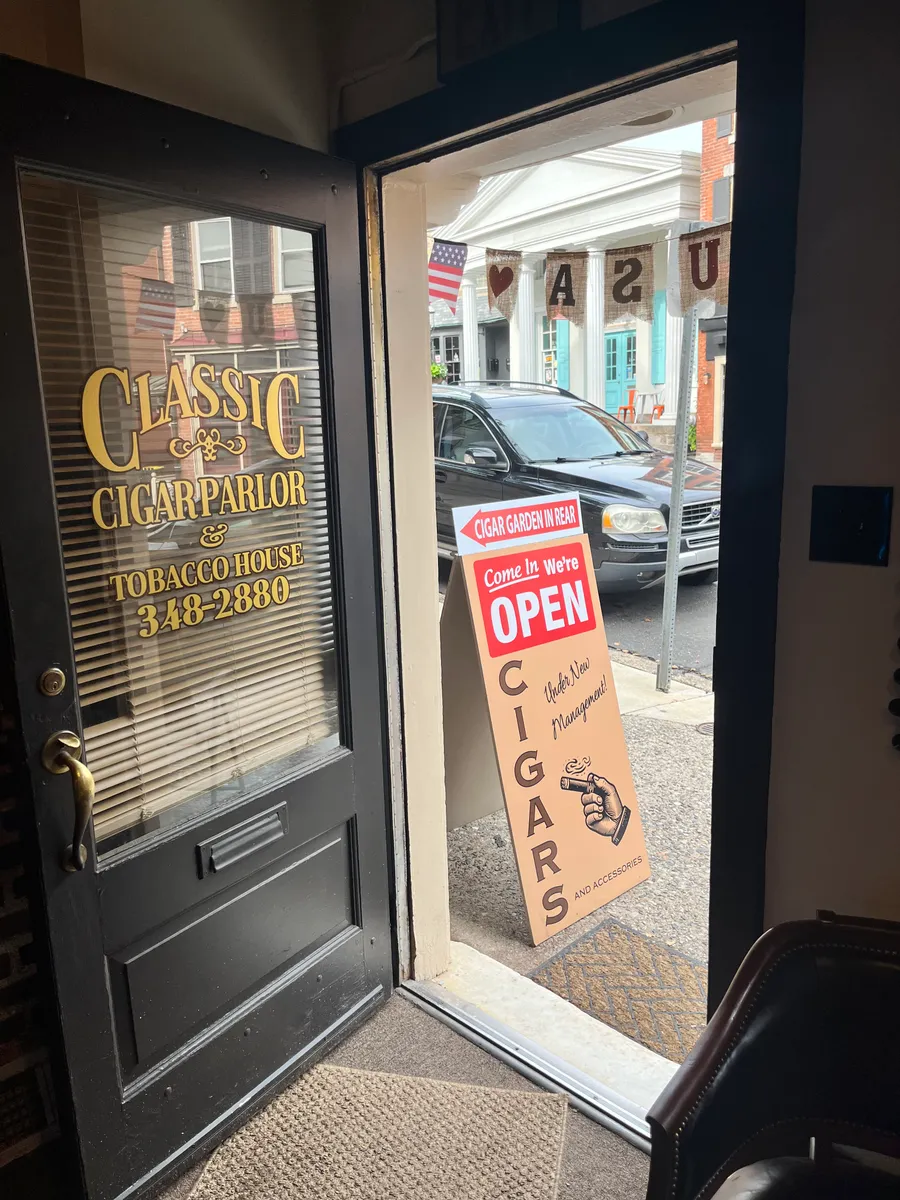 The view out of the front door onto North Main Street, with the gold Classic Cigar Parlor lettering on the glass